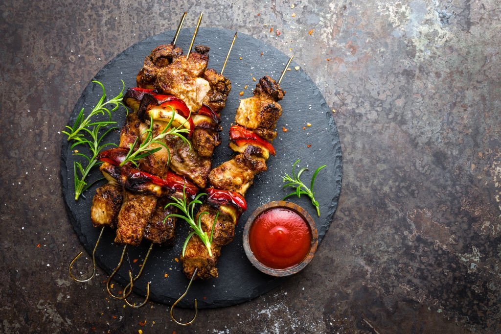 Grilled meat skewers, shish kebab with onion and sweet pepper