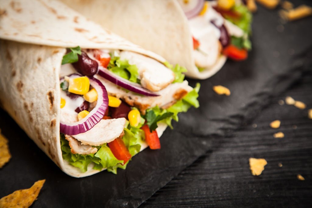 Traditional mexican tortilla wrap with a mix of ingredients